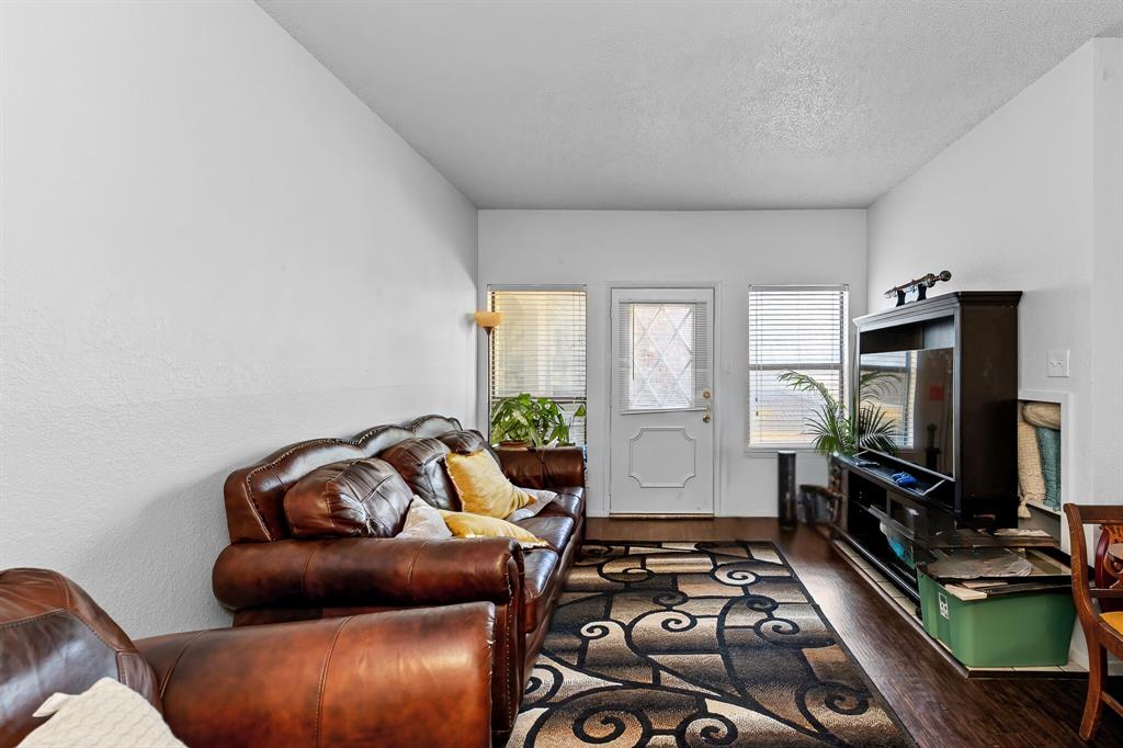 806 West 24th Street, Unit 214 Austin, TX 78705 - Photo 8 of 30 a living room with furniture and a flat screen tv