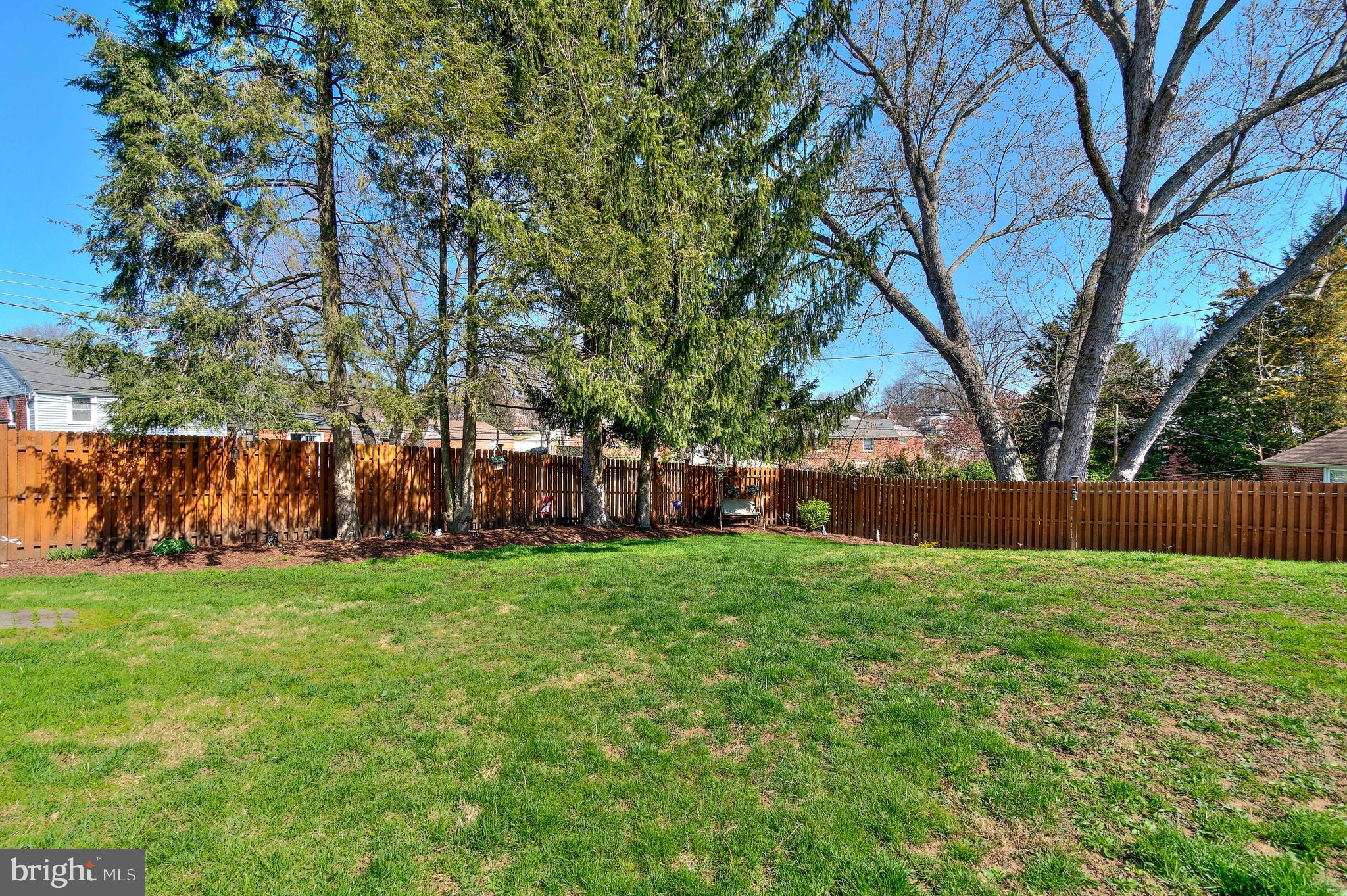 614 Cambridge Road Brookhaven, PA 19015 - Photo 40 of 40 Shadow box cedar fencing & custom retaining wall