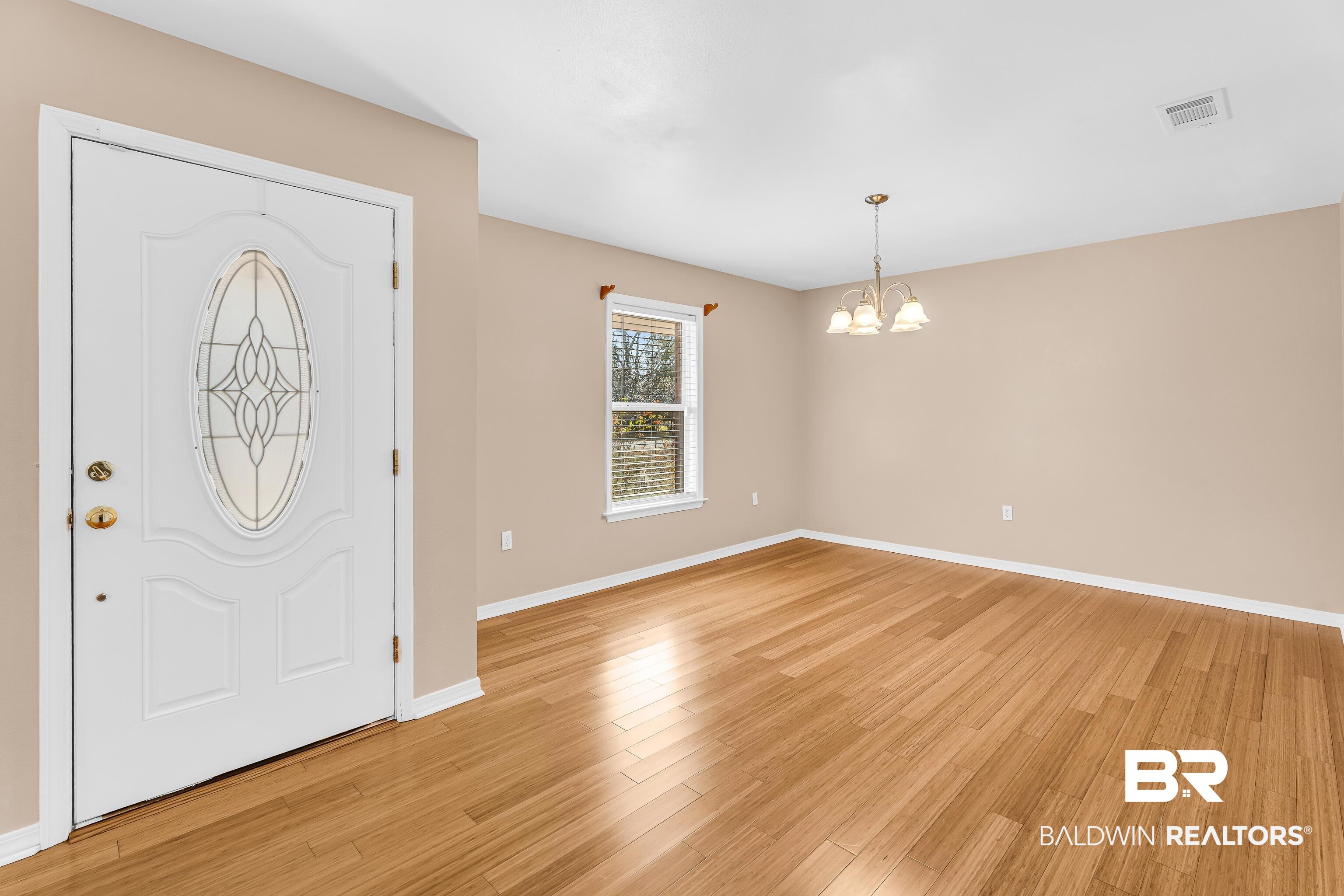 22095 8th Street Silverhill, AL 36576 - Photo 16 of 42 Entryway featuring light wood-style floors and suspended lighting