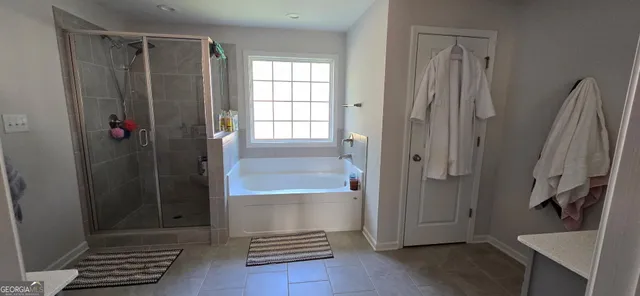 a bathroom with a shower and a sink