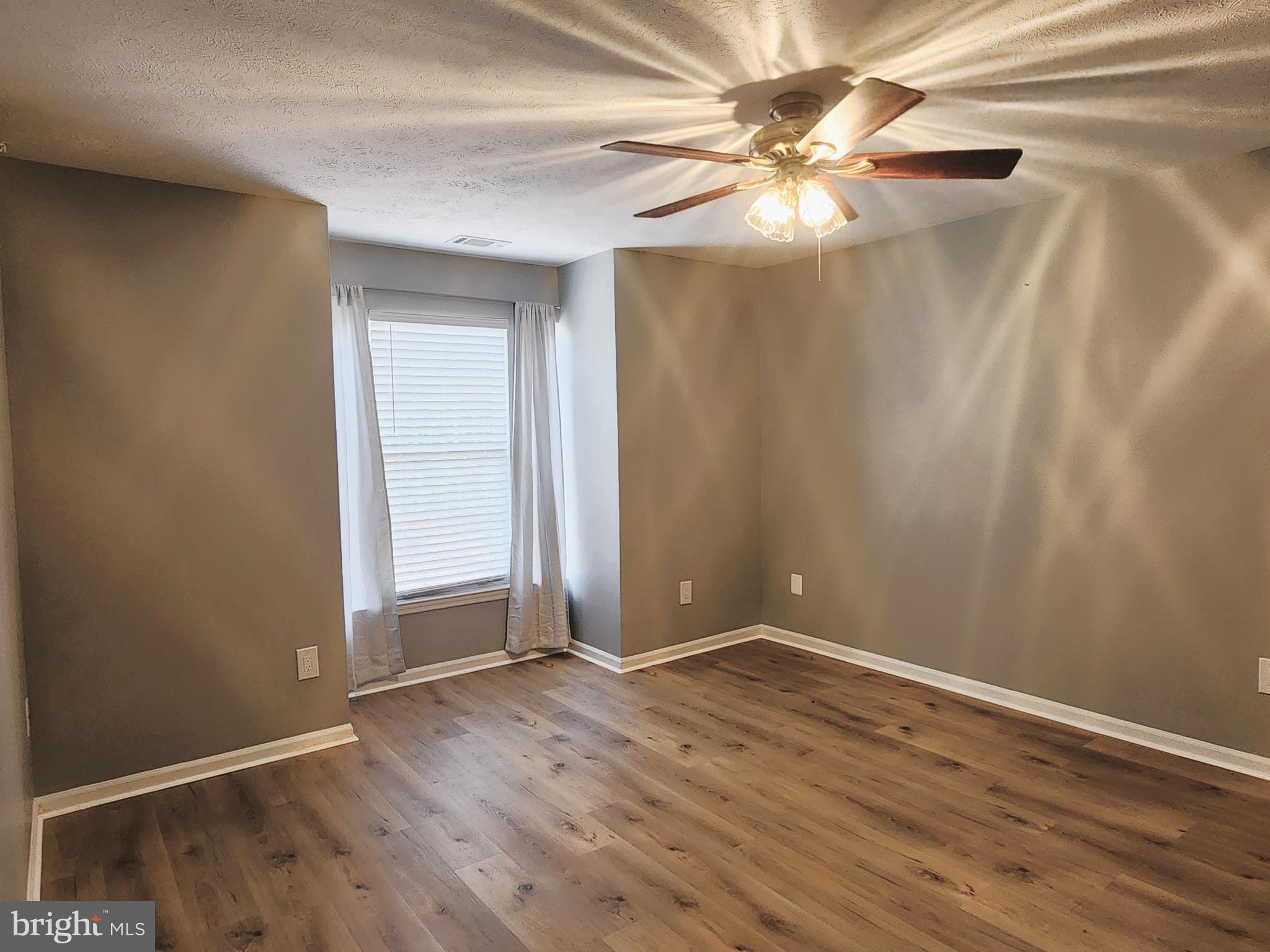 16 Laurel Path Court, Unit 1 Nottingham, MD 21236 - Photo 16 of 23 a view of an empty room with wooden floor