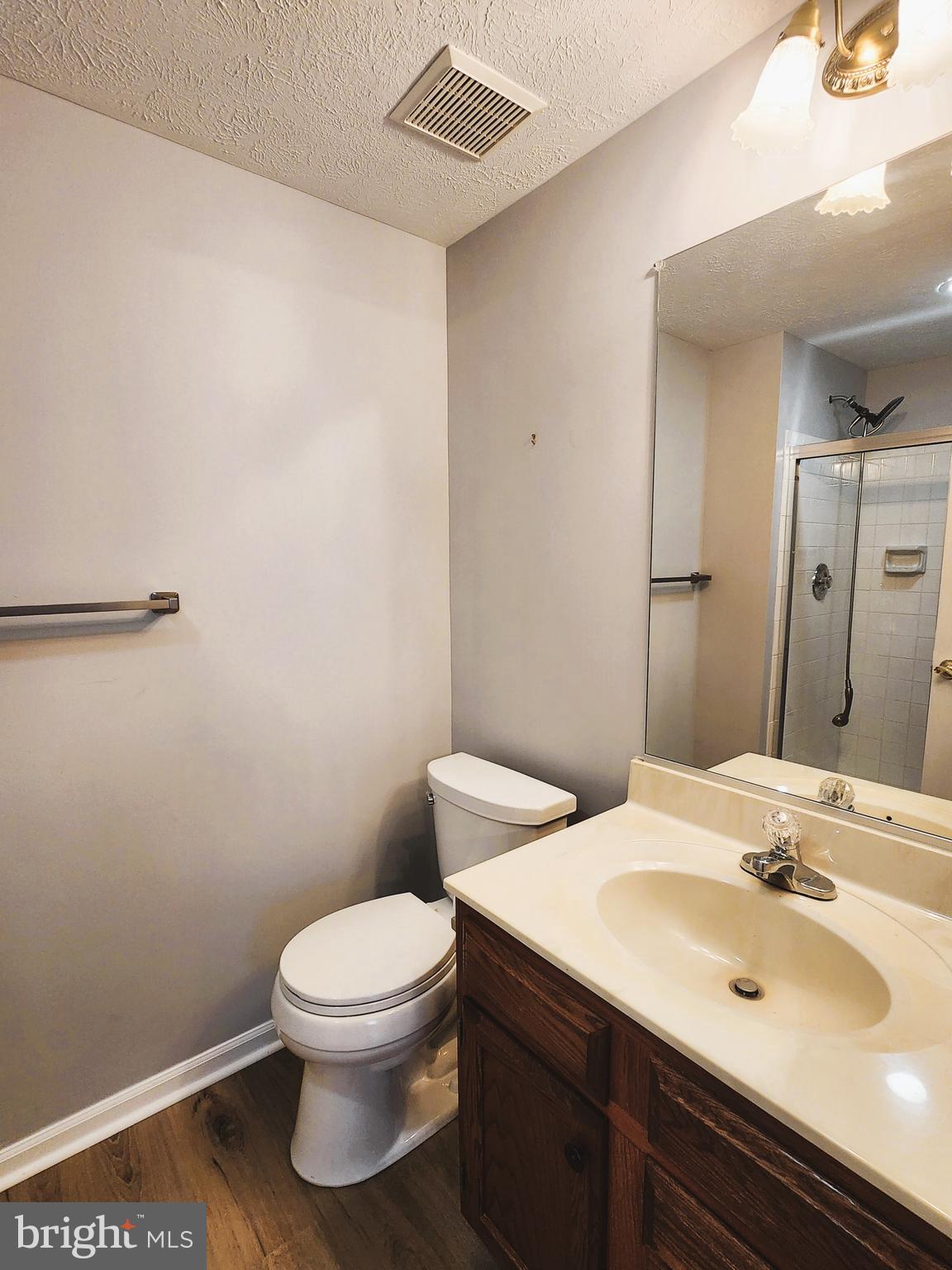 16 Laurel Path Court, Unit 1 Nottingham, MD 21236 - Photo 18 of 23 a bathroom with a sink a toilet and mirror