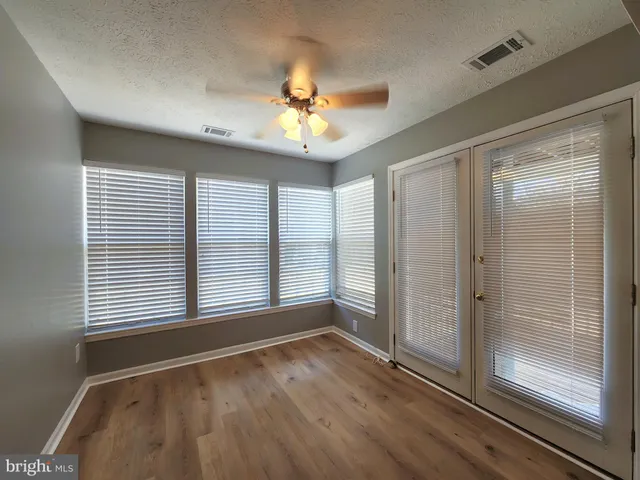 a view of balcony with wooden floor