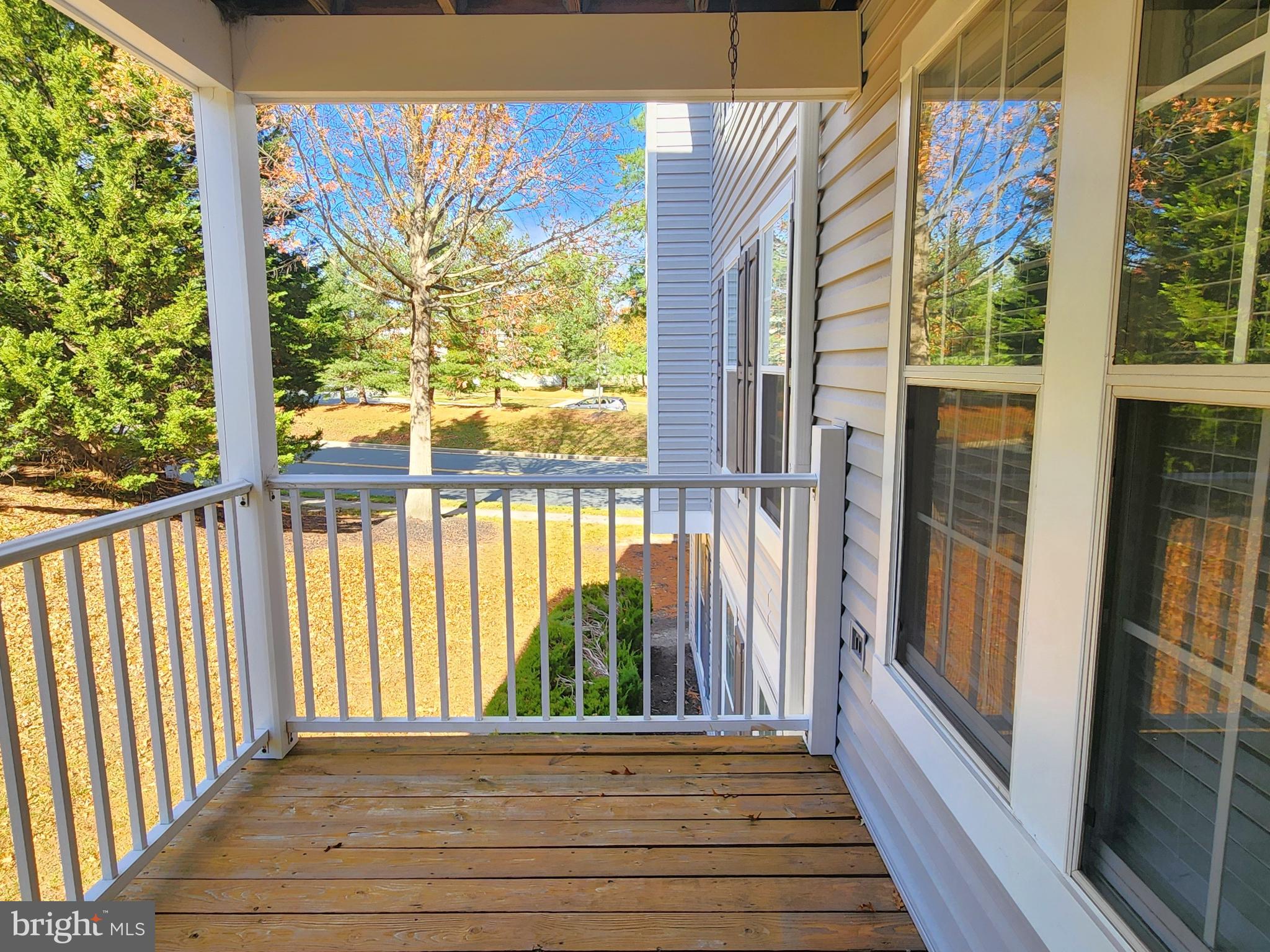 16 Laurel Path Court, Unit 1 Nottingham, MD 21236 - Photo 8 of 23 a view of a balcony with wooden floor
