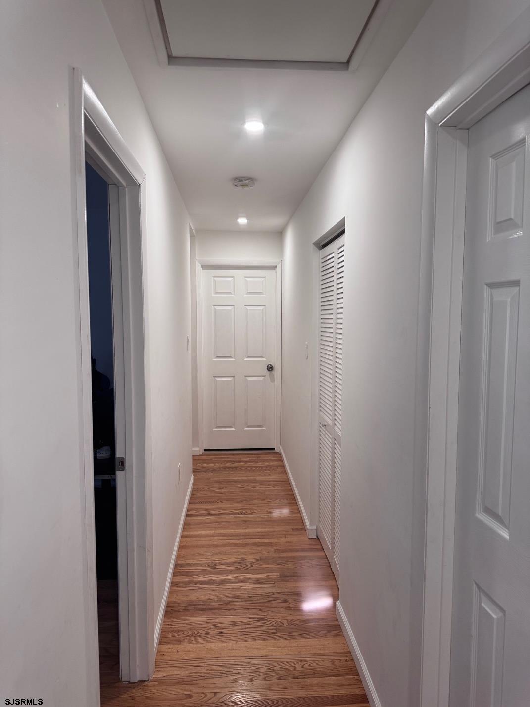 12 Colwick Drive Somers Point, NJ 08244 - Photo 7 of 17 a view of a hallway with wooden floor