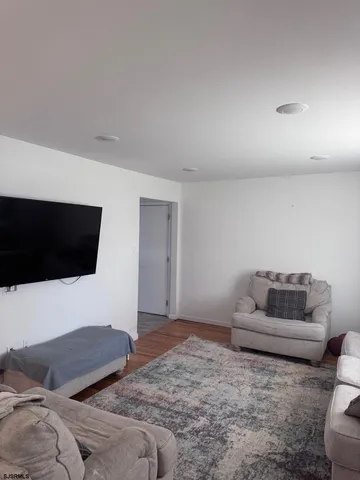 a bedroom with a bed and a television