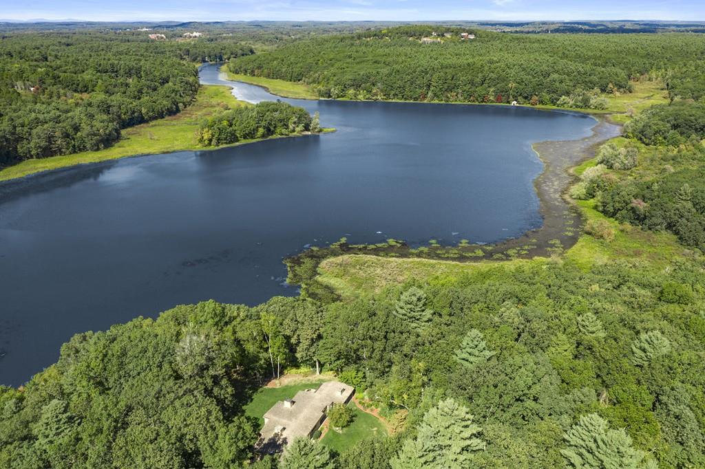 a view of a lake with a yard