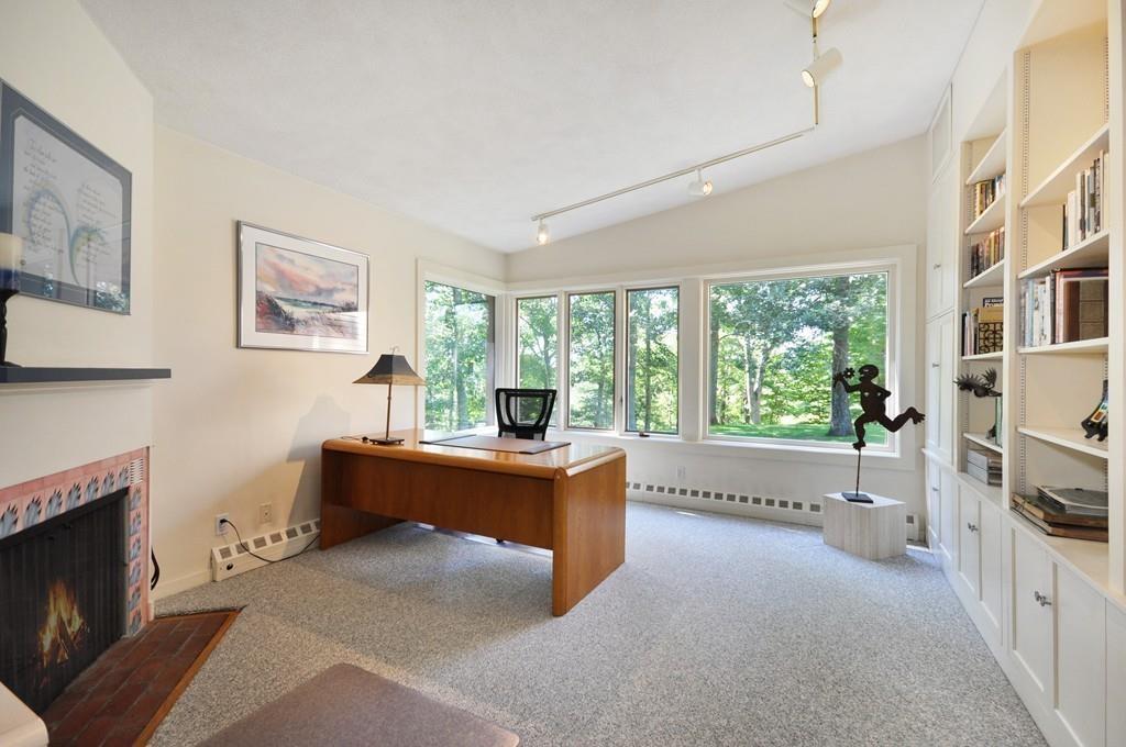 263 Old Concord Road Lincoln, MA 01773 - Photo 18 of 41 a living room with furniture and a fireplace