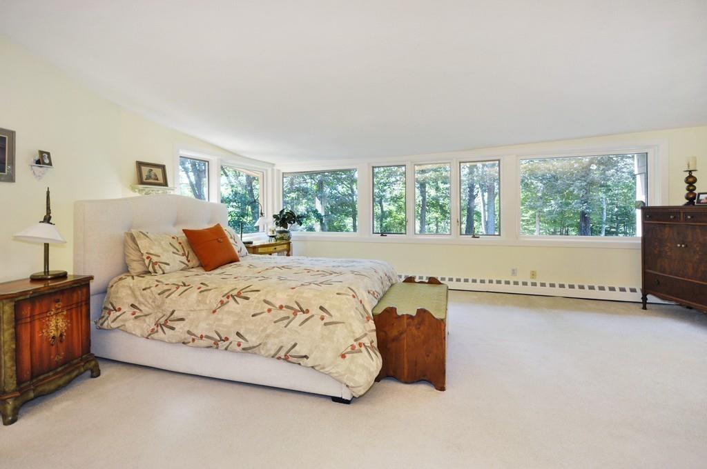 263 Old Concord Road Lincoln, MA 01773 - Photo 19 of 41 a bedroom with a bed and a large window