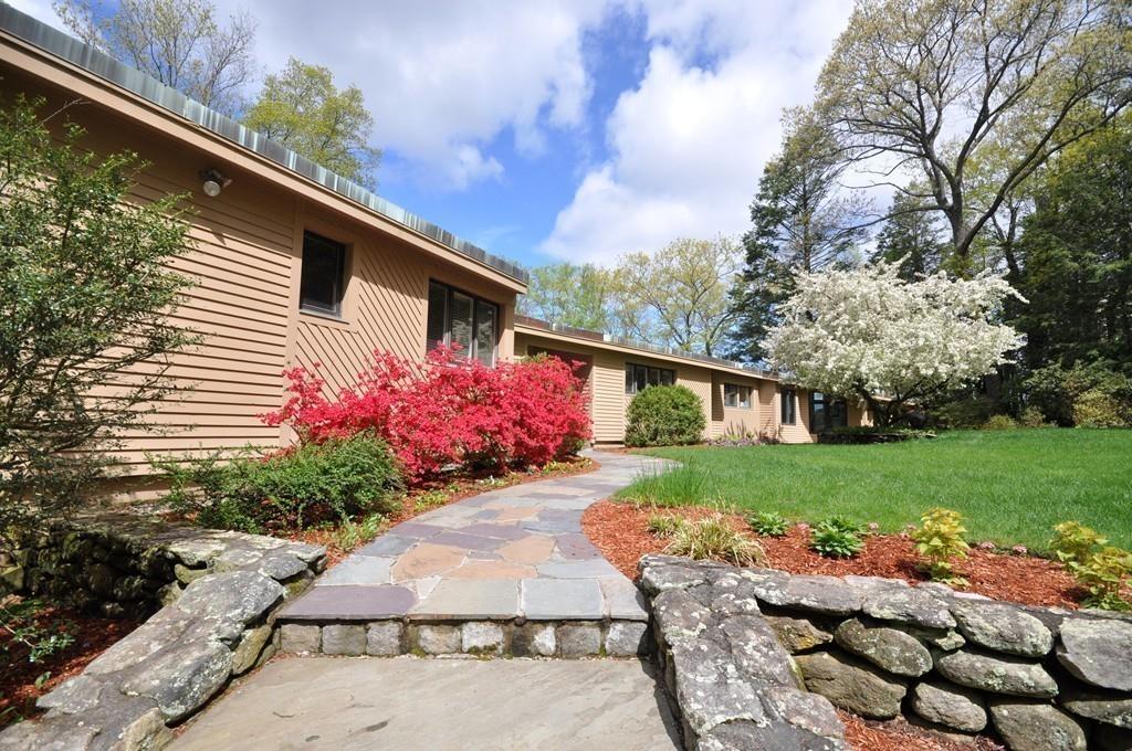 263 Old Concord Road Lincoln, MA 01773 - Photo 26 of 41 a front view of a house with a yard