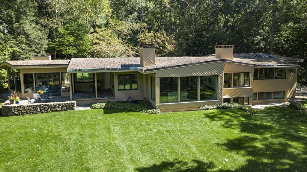 263 Old Concord Road Lincoln, MA 01773 - Photo 3 of 41 a front view of a house with a yard and porch
