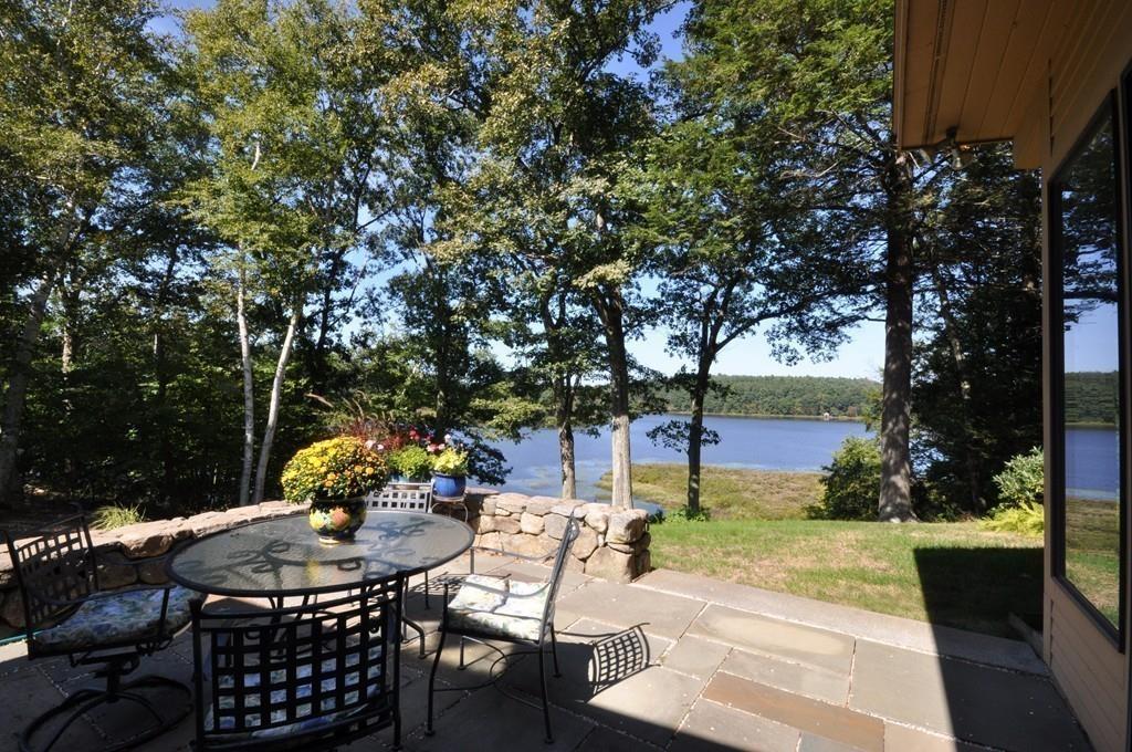 263 Old Concord Road Lincoln, MA 01773 - Photo 31 of 41 a view of a patio with table and chairs potted plants and large tree