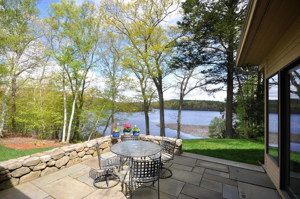 263 Old Concord Road Lincoln, MA 01773 - Photo 7 of 41 a view of a patio with a table chairs and a backyard