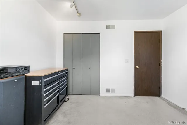 a view of an empty room with a fireplace