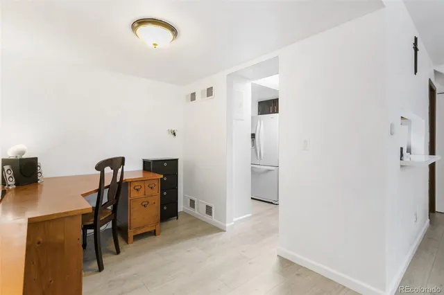 a view of a workspace with furniture