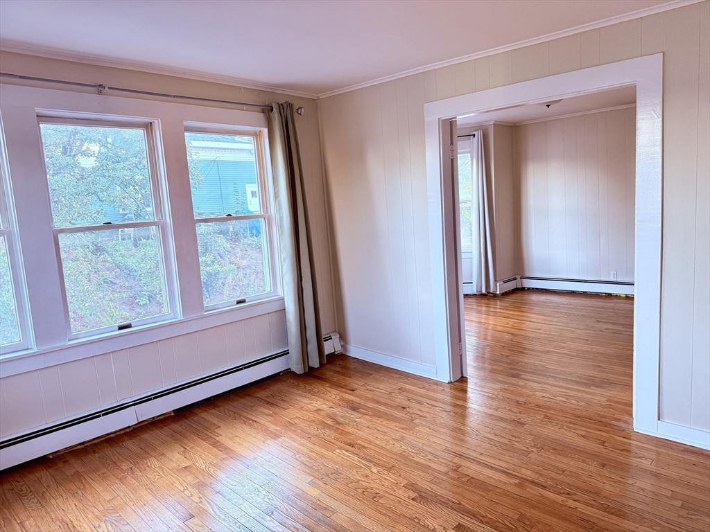 2 Chase Street, Unit 2 Beverly, MA 01915 - Photo 6 of 11 a view of empty room with wooden floor and fan