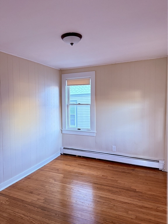 2 Chase Street, Unit 2 Beverly, MA 01915 - Photo 8 of 11 a view of room with hardwood floor and window