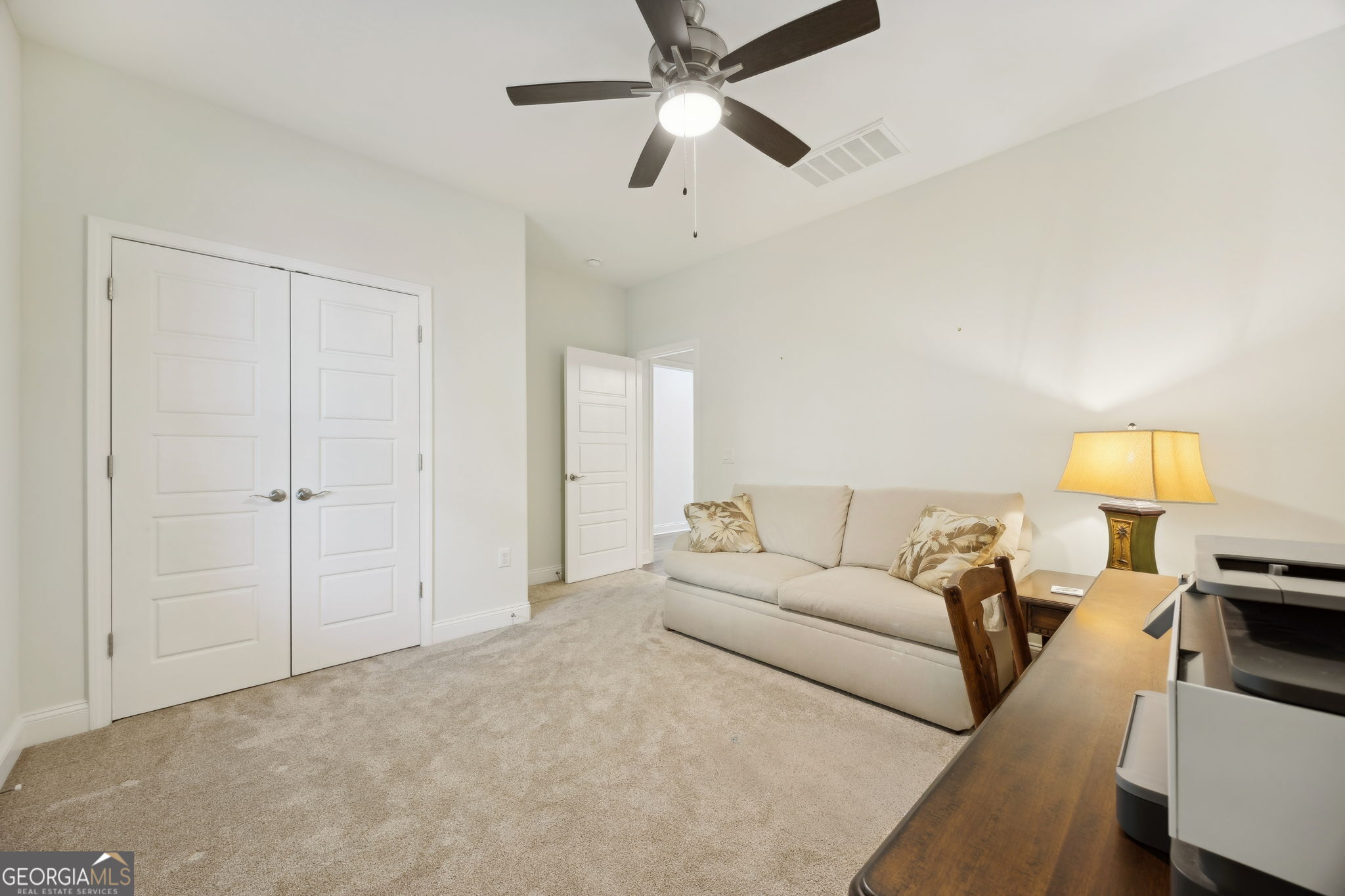 212 Placid Road St. Marys, GA 31558 - Photo 13 of 75 a living room with furniture and a lamp