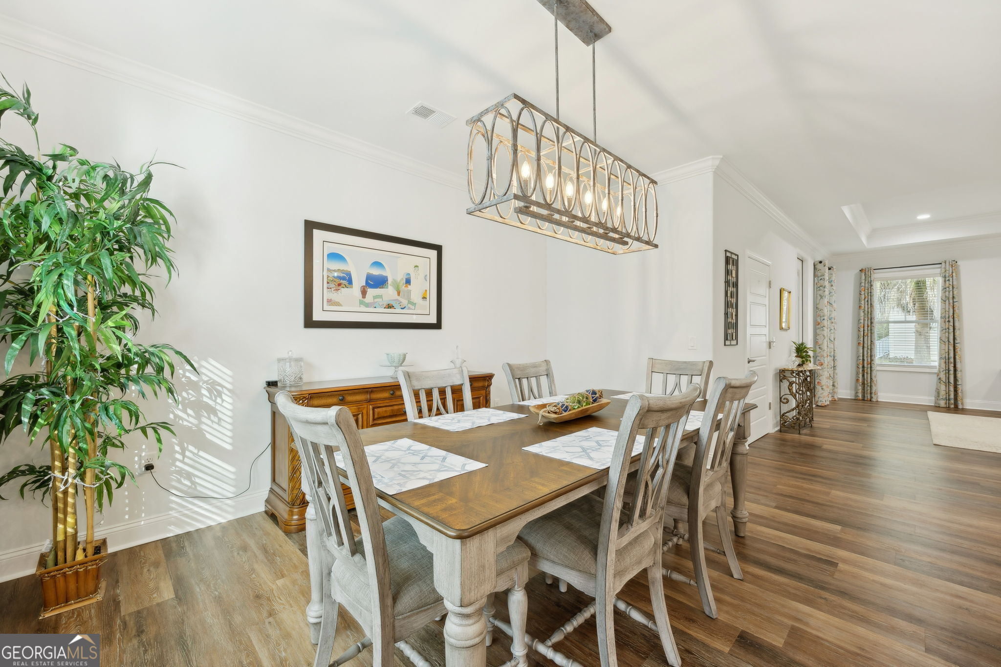 212 Placid Road St. Marys, GA 31558 - Photo 14 of 75 a view of a dining room with furniture and wooden floor