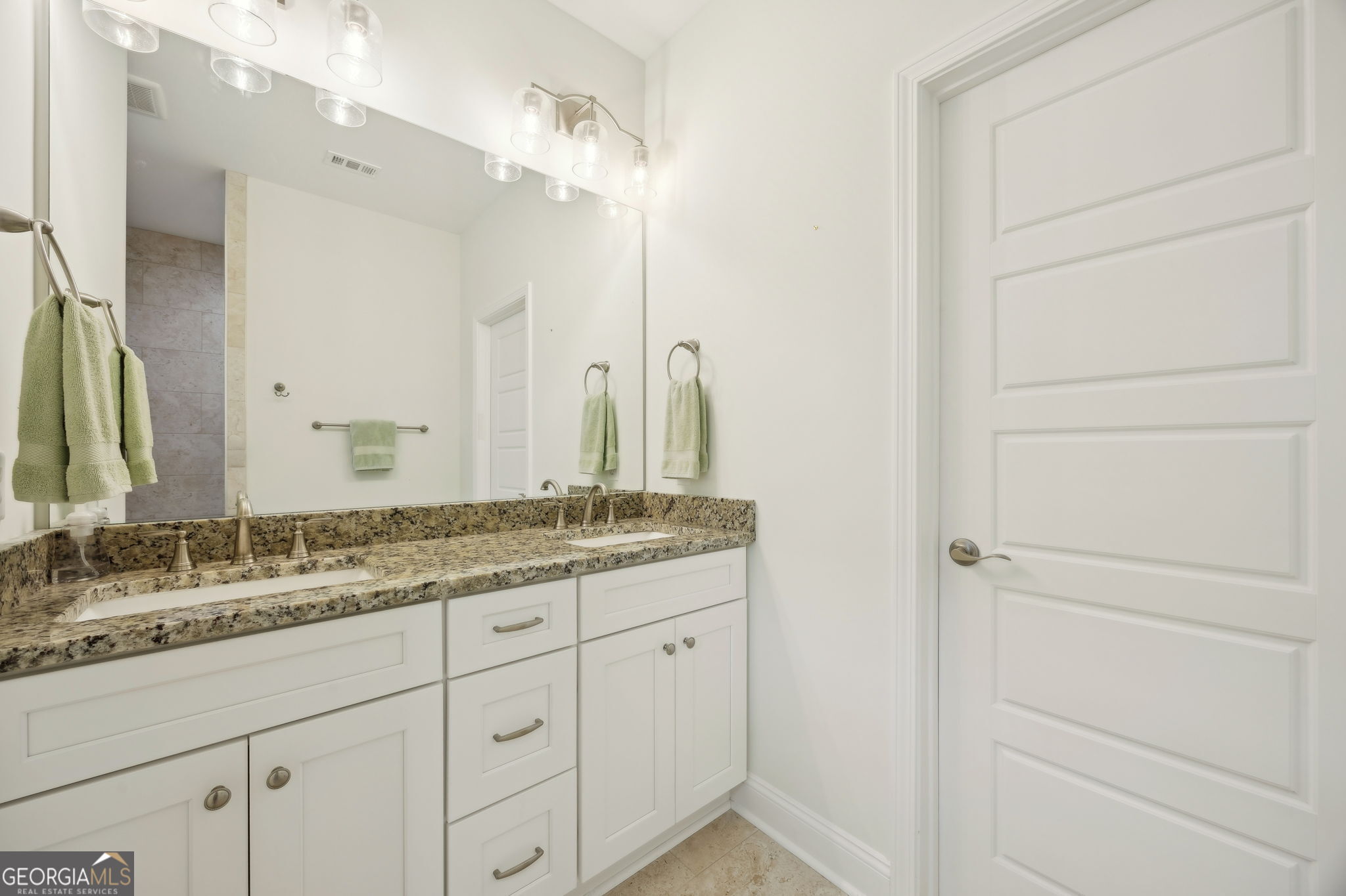212 Placid Road St. Marys, GA 31558 - Photo 22 of 75 a bathroom with a granite countertop sink and a mirror