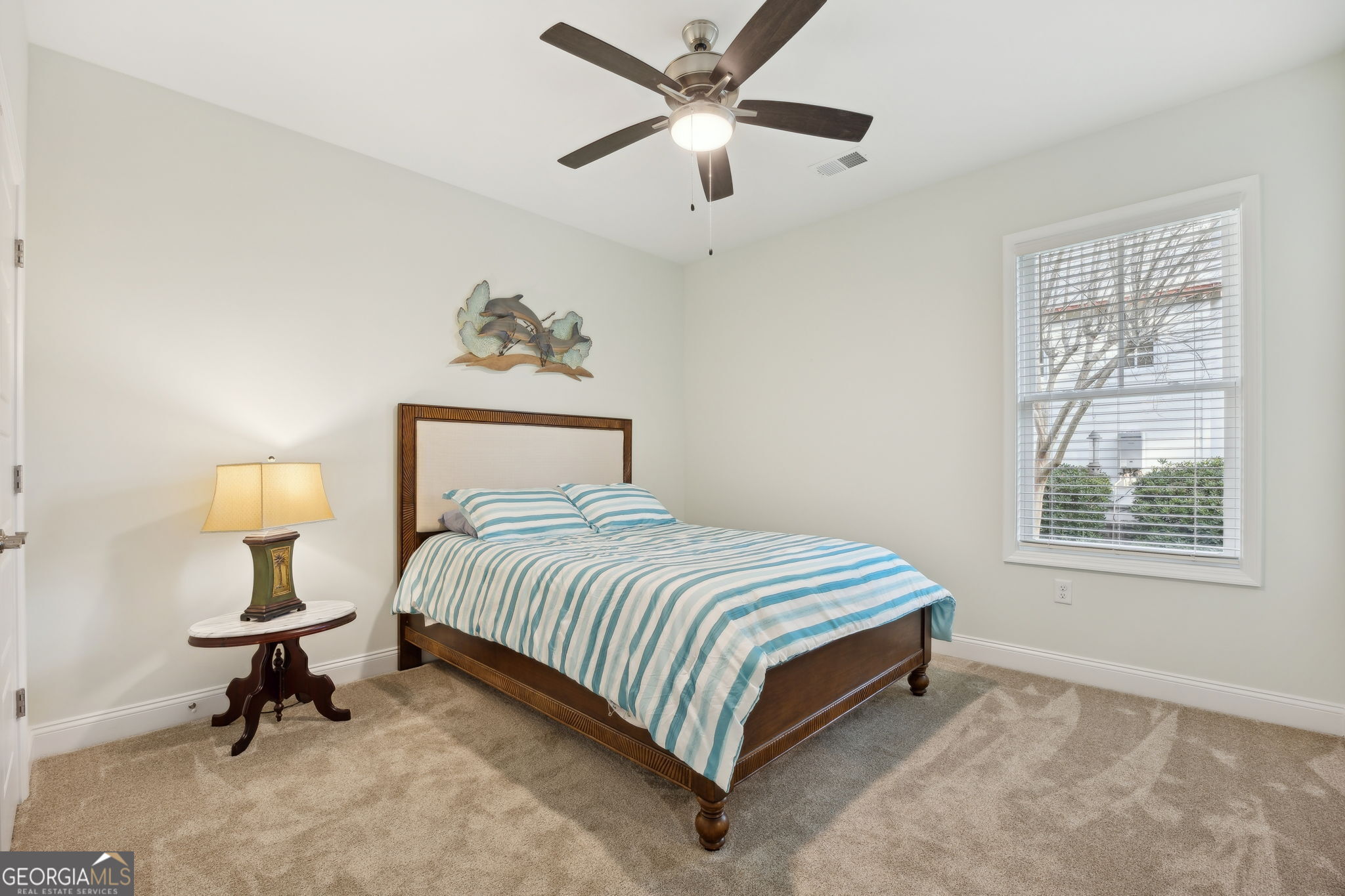 212 Placid Road St. Marys, GA 31558 - Photo 26 of 75 a bedroom with a bed and a chandelier