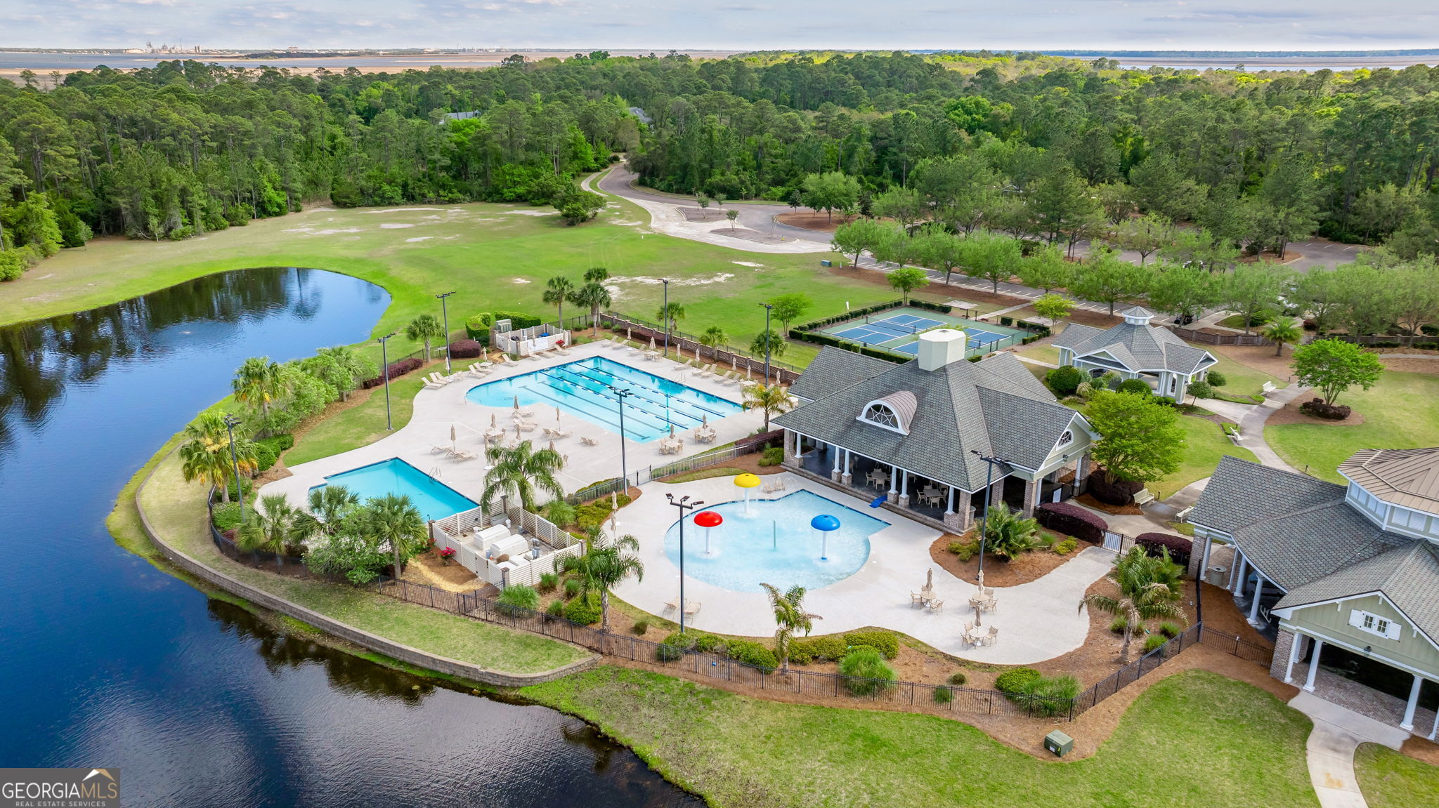 212 Placid Road St. Marys, GA 31558 - Photo 63 of 75 an aerial view of a house with a garden and swimming pool