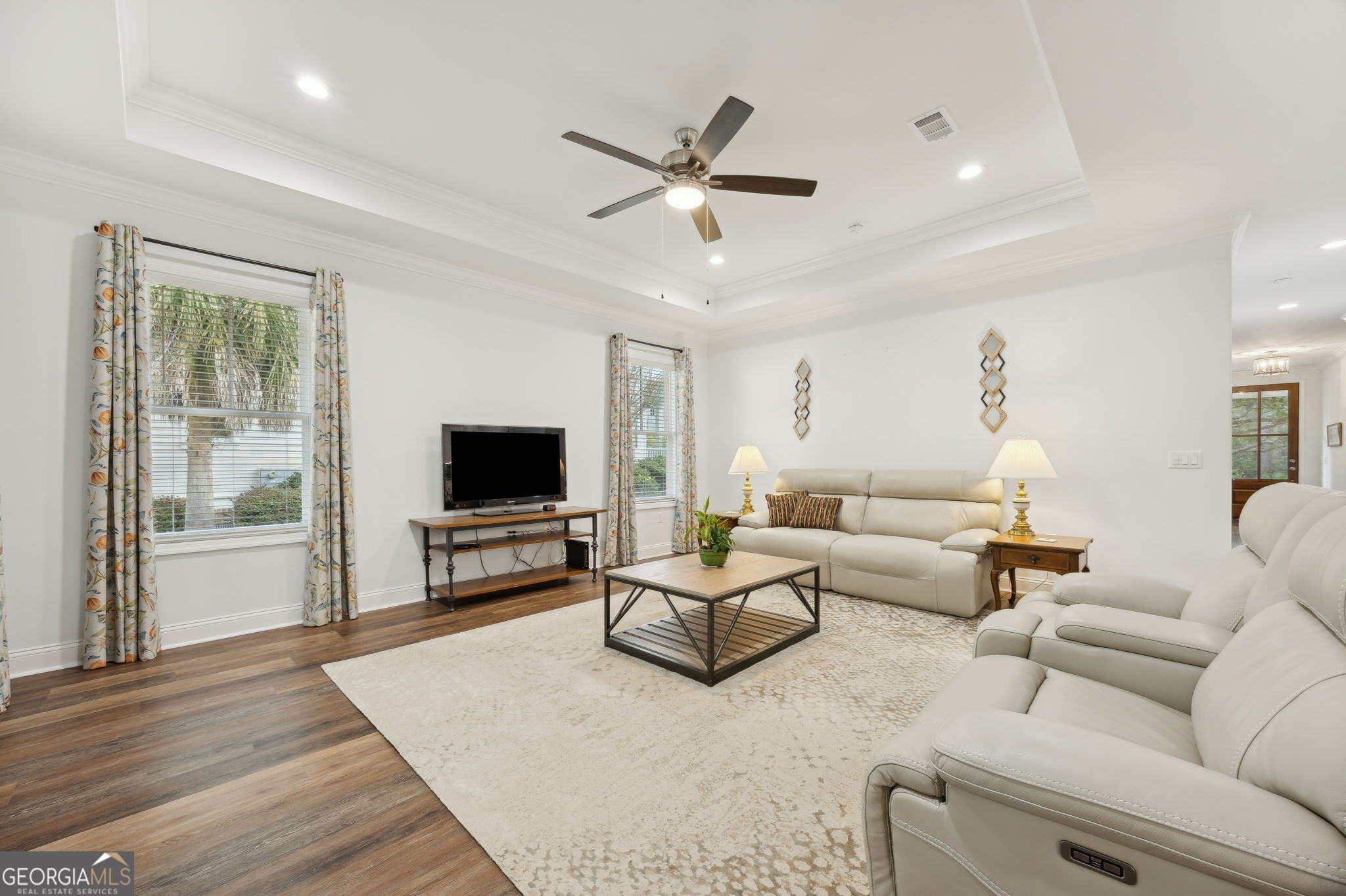 212 Placid Road St. Marys, GA 31558 - Photo 9 of 75 a living room with furniture and a flat screen tv with wooden floor