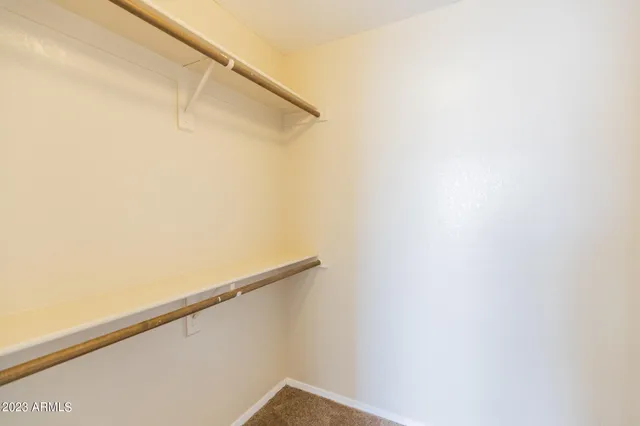 a bathroom with a tub a double vanity sink and a mirror