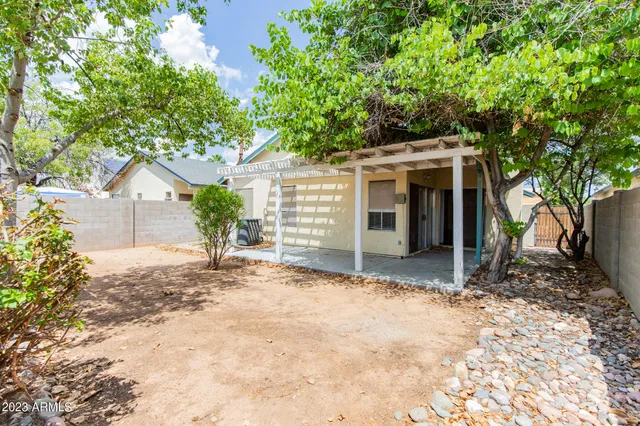 a view of a house with a yard and garage