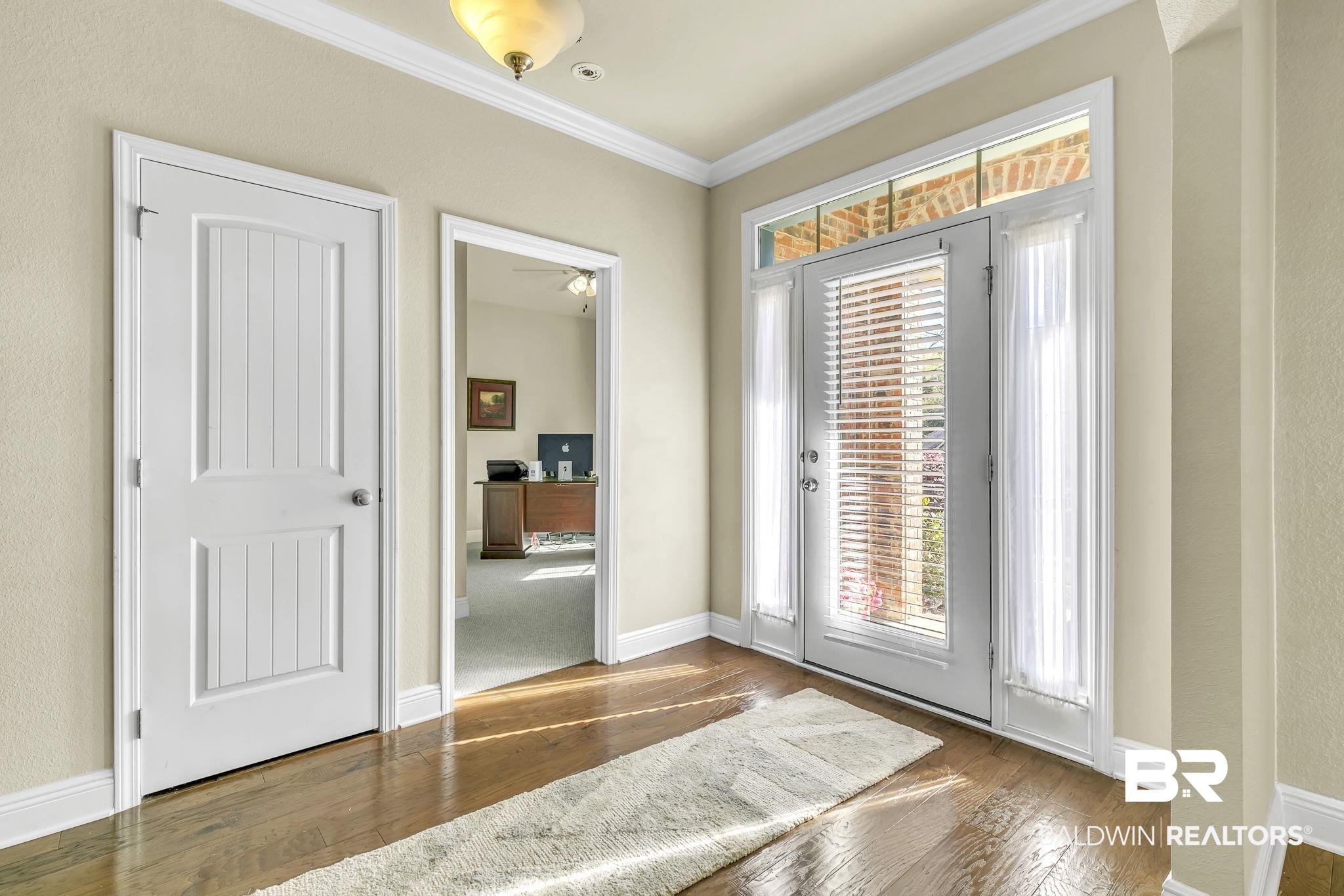 21439 Brick Stack Lane Fairhope, AL 36532 - Photo 4 of 32 Entryway featuring baseboards, crown molding, and hardwood / wood-style flooring