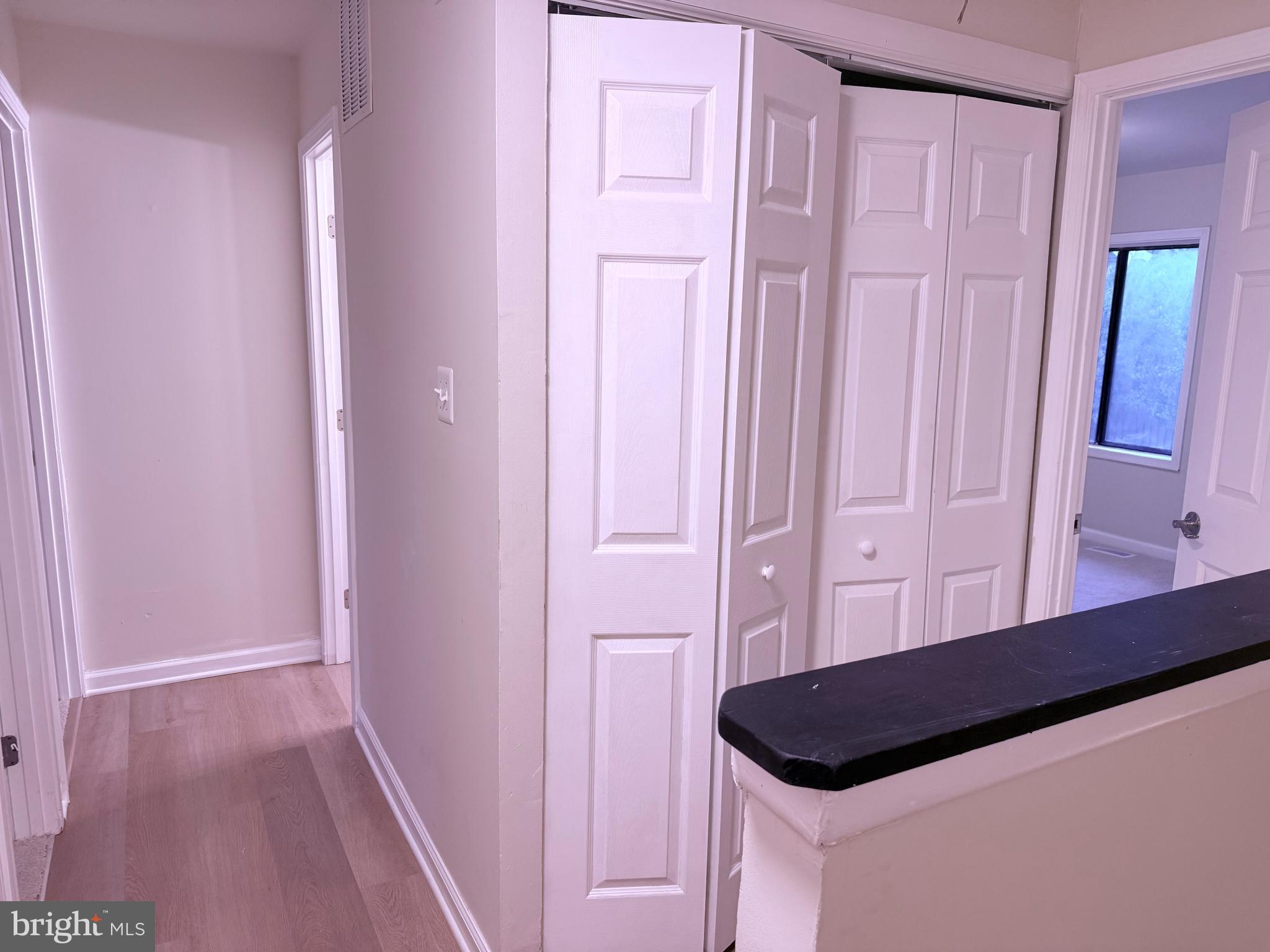 1287 Springtide Place Herndon, VA 20170 - Photo 13 of 23 a room with a wooden floor and cabinets