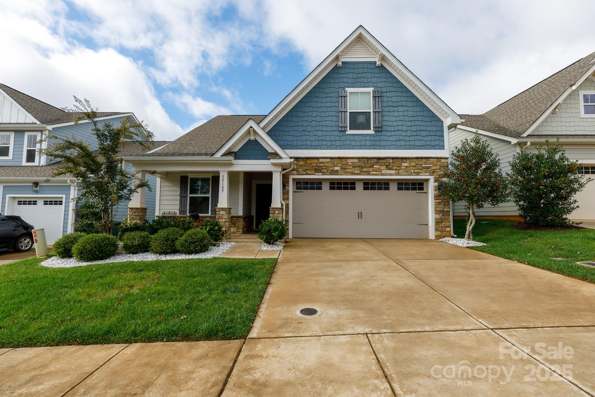 50109 Robins Nest Lane Lancaster, SC 29720 - Photo 1 of 45 a front view of a house with a yard and garage