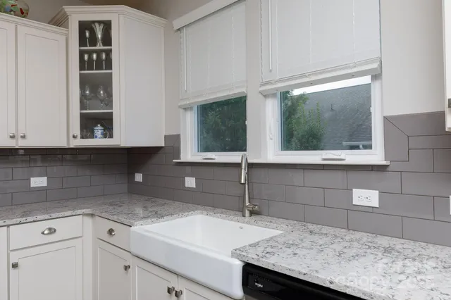 a kitchen with a sink and cabinets