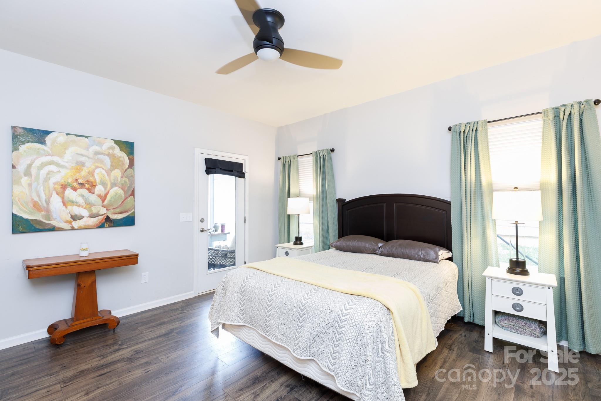 50109 Robins Nest Lane Lancaster, SC 29720 - Photo 16 of 45 a bedroom with a bed and a chandelier