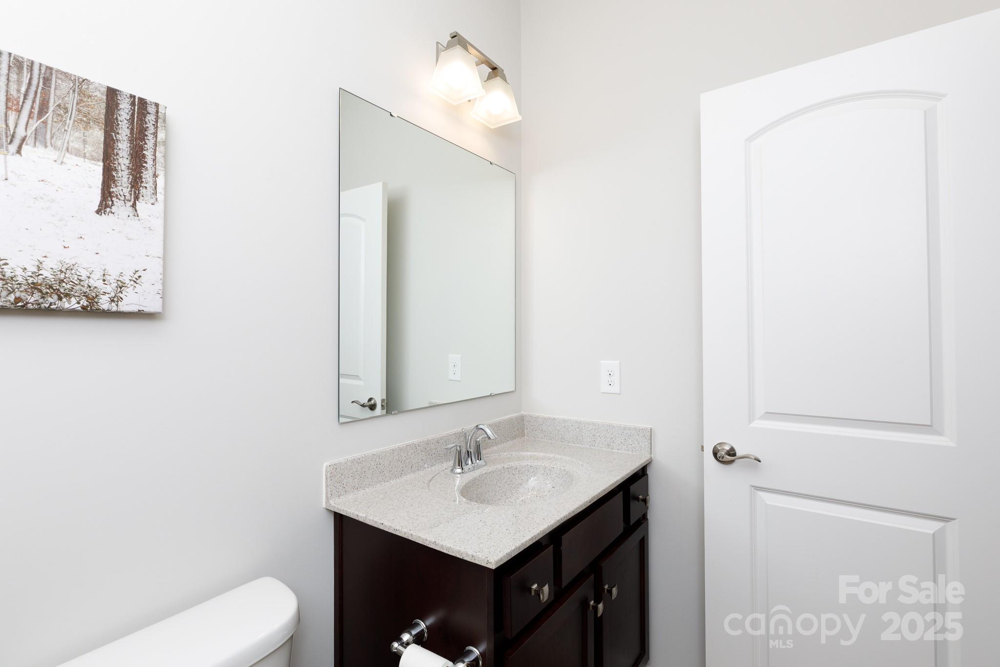 50109 Robins Nest Lane Lancaster, SC 29720 - Photo 20 of 45 a bathroom with a toilet sink and mirror
