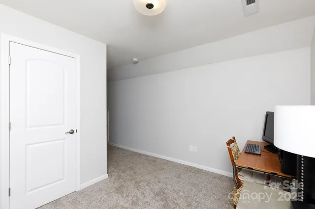 a view of workspace room with wooden floor and chair