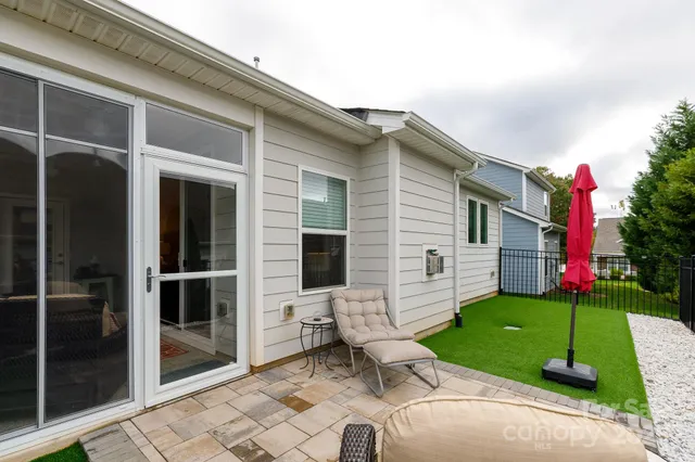 a front view of a house with a yard and porch