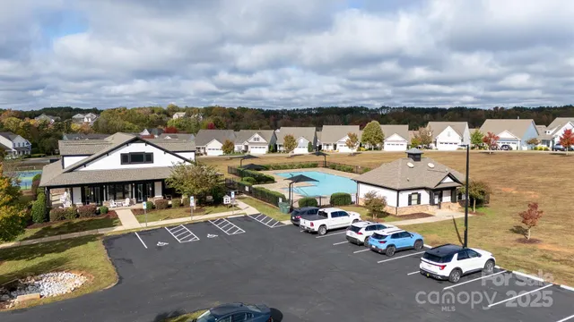 a view of a lake with lawn chairs