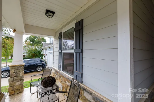 a workspace room with furniture and a window