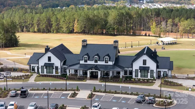 an aerial view of a house with swimming pool