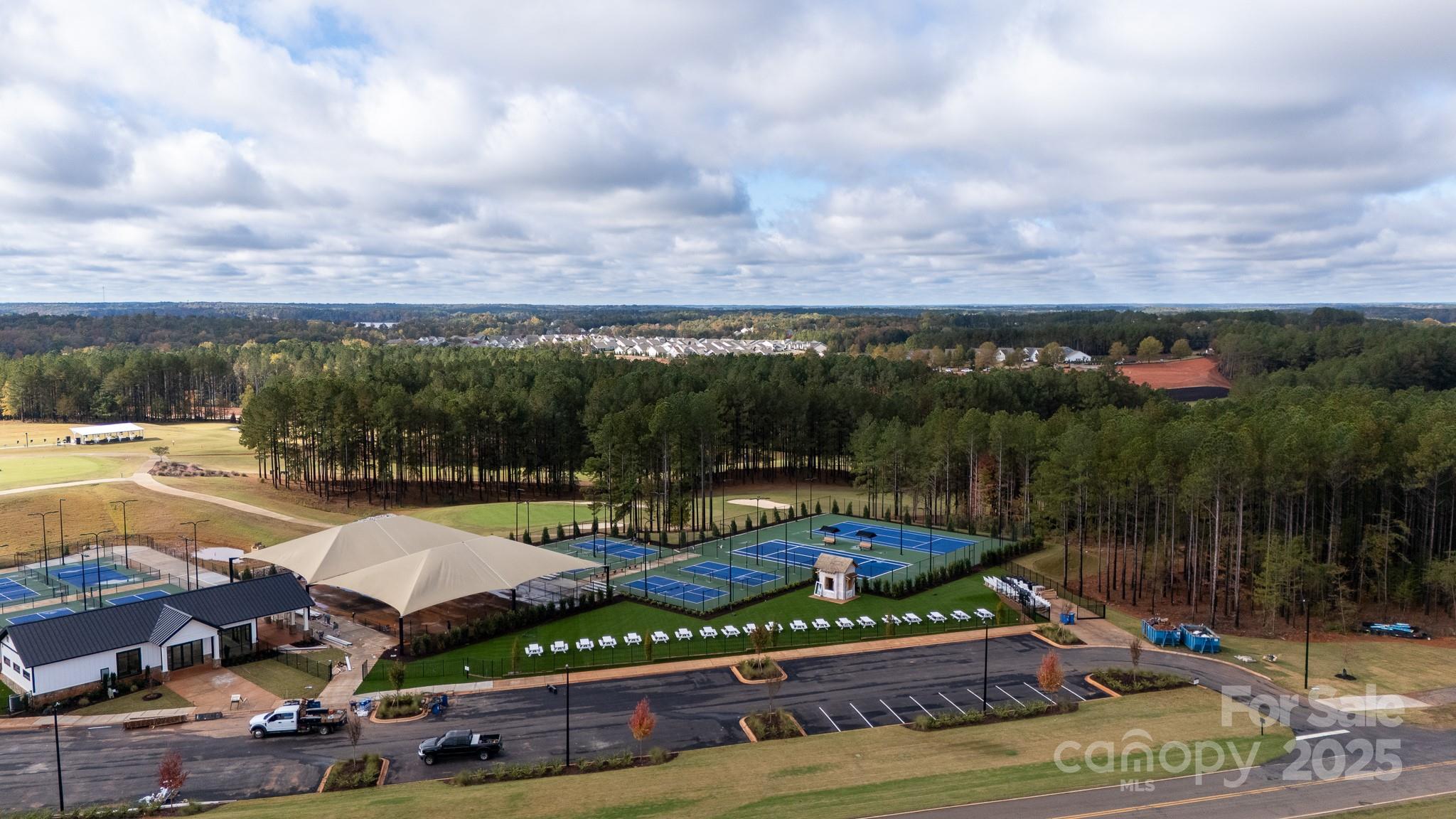 50109 Robins Nest Lane Lancaster, SC 29720 - Photo 45 of 45 a view of a swimming pool with lawn chairs under an umbrella