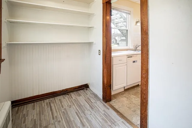 a view of front door with wooden floor