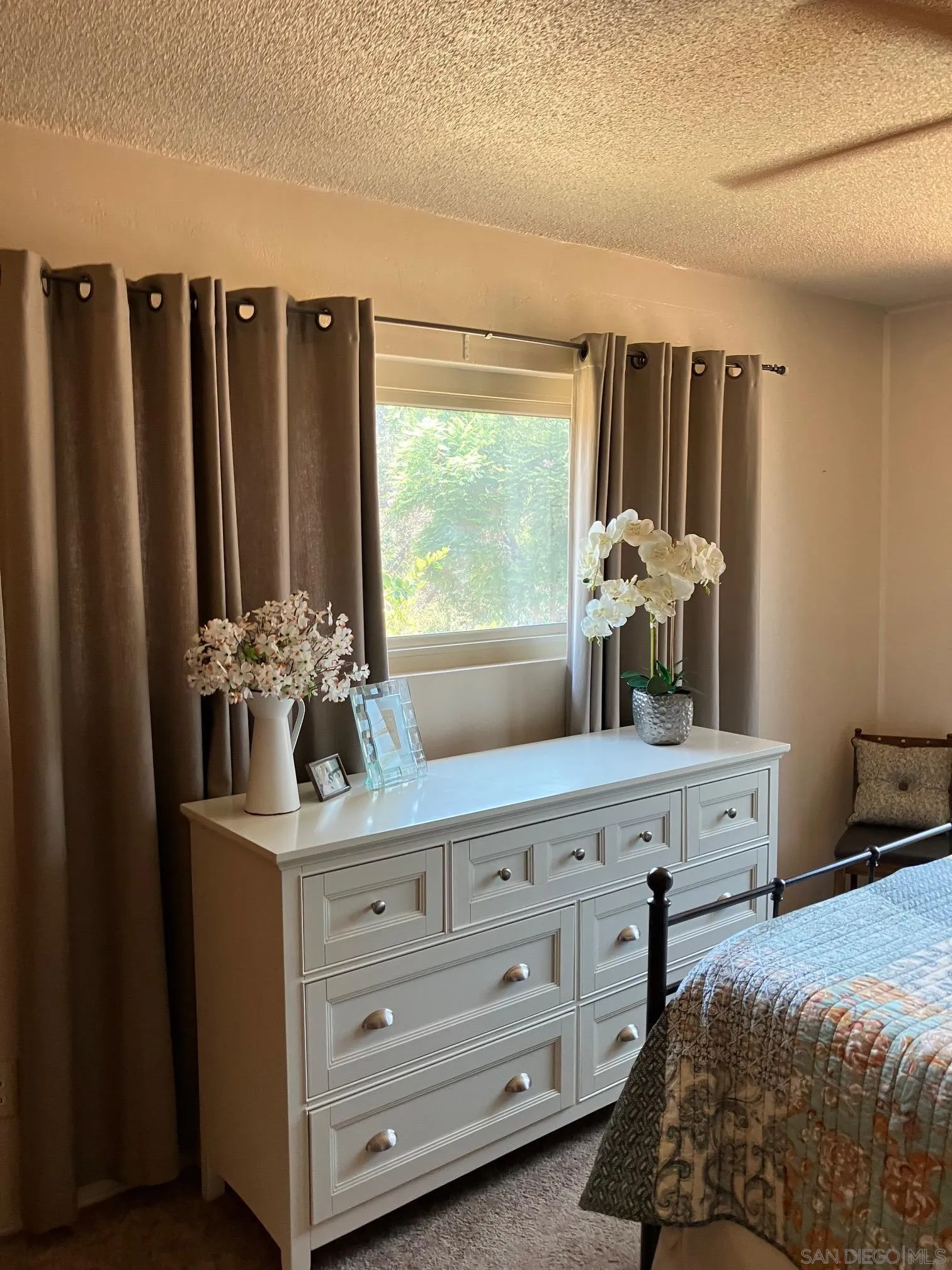 17066 Highway 94 Jamul, CA 91935 - Photo 19 of 23 a bedroom with a bed and a dresser