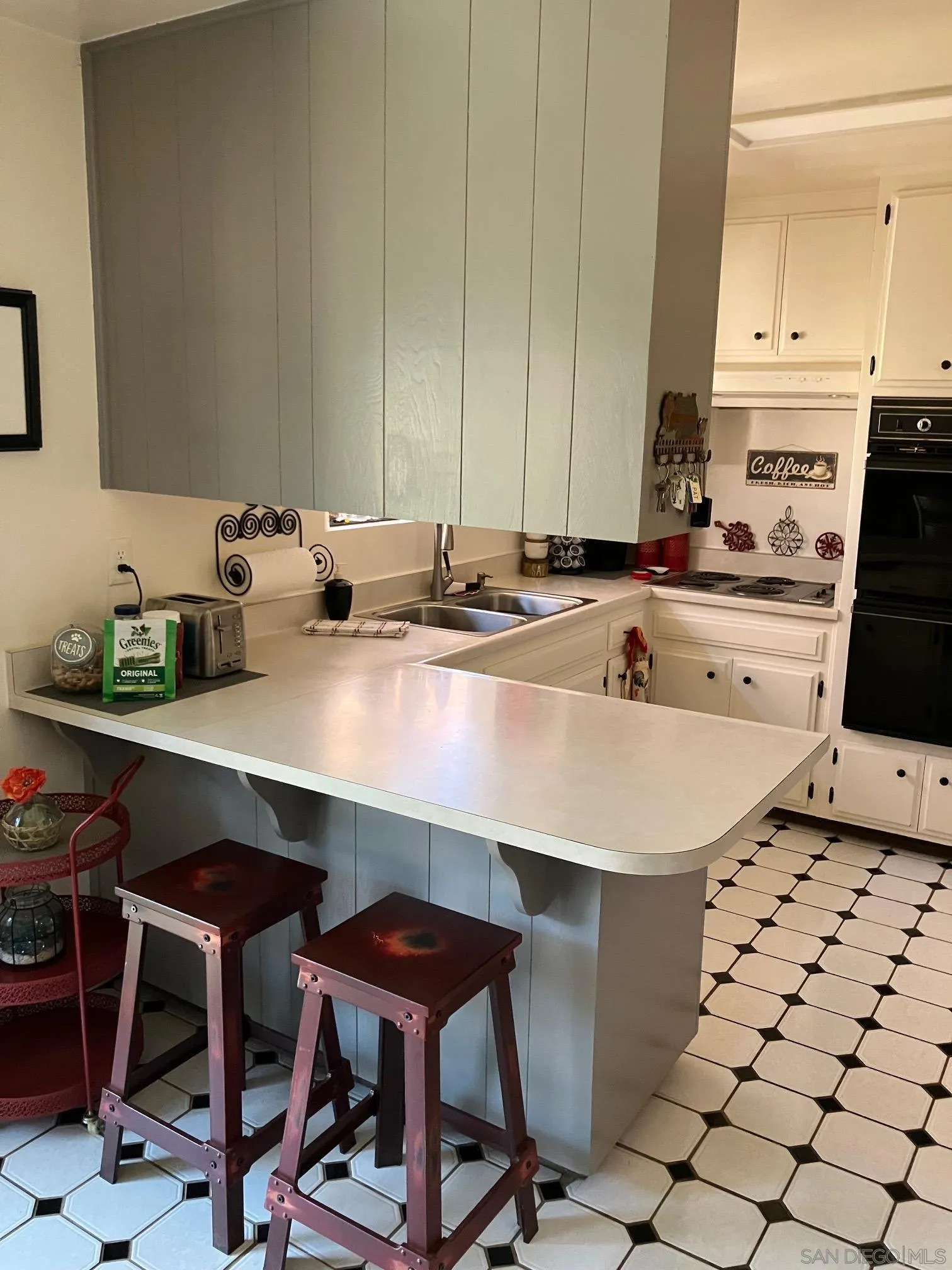 17066 Highway 94 Jamul, CA 91935 - Photo 9 of 23 a kitchen with a sink a stove and white cabinets