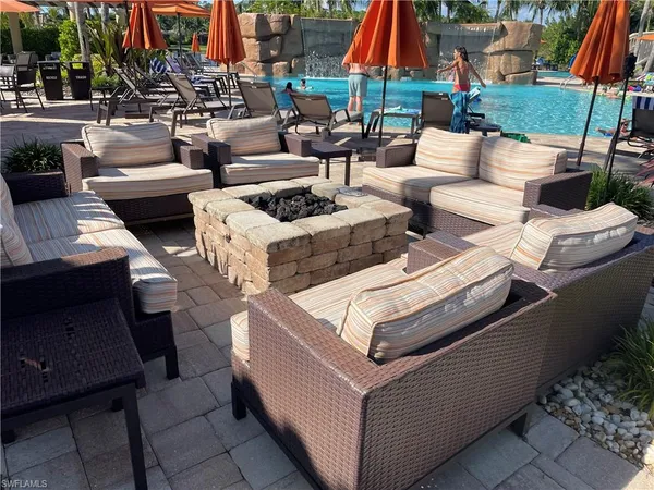 a view of a patio with couches and chairs