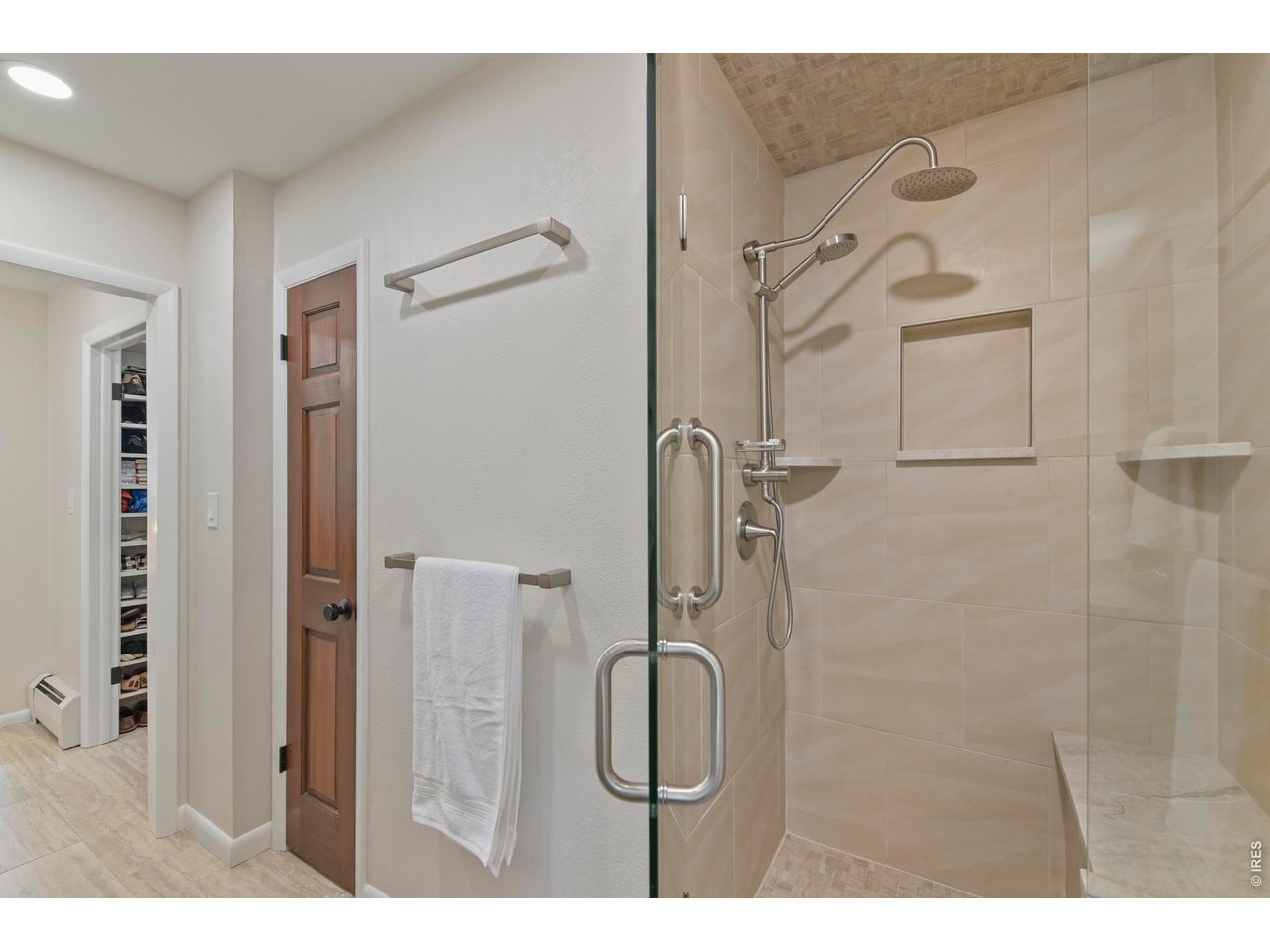 19 Ridge Road Boulder, CO 80303 - Photo 34 of 49 Primary Shower with seat and multiple shower heads.