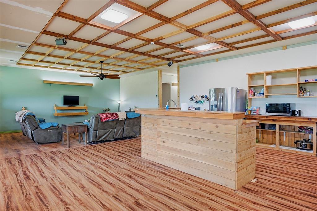 1464 Keyes Road Sherman, TX 75092 - Photo 12 of 29 a bedroom with furniture and a wooden floor