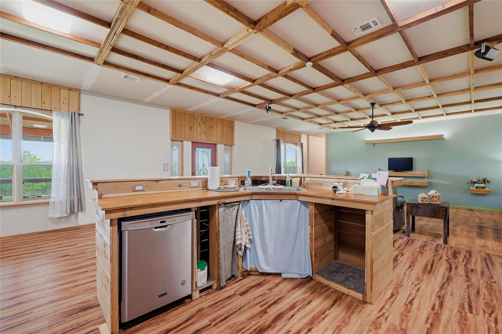 1464 Keyes Road Sherman, TX 75092 - Photo 13 of 29 a kitchen with a sink and wooden floor
