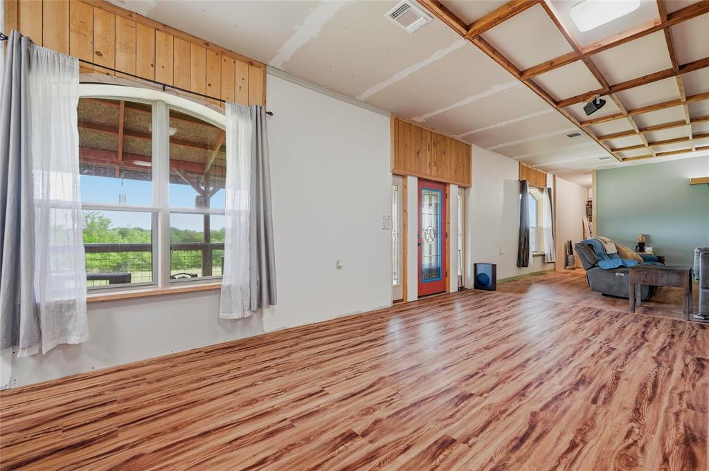 1464 Keyes Road Sherman, TX 75092 - Photo 15 of 29 a view of a room with wooden floor and furniture