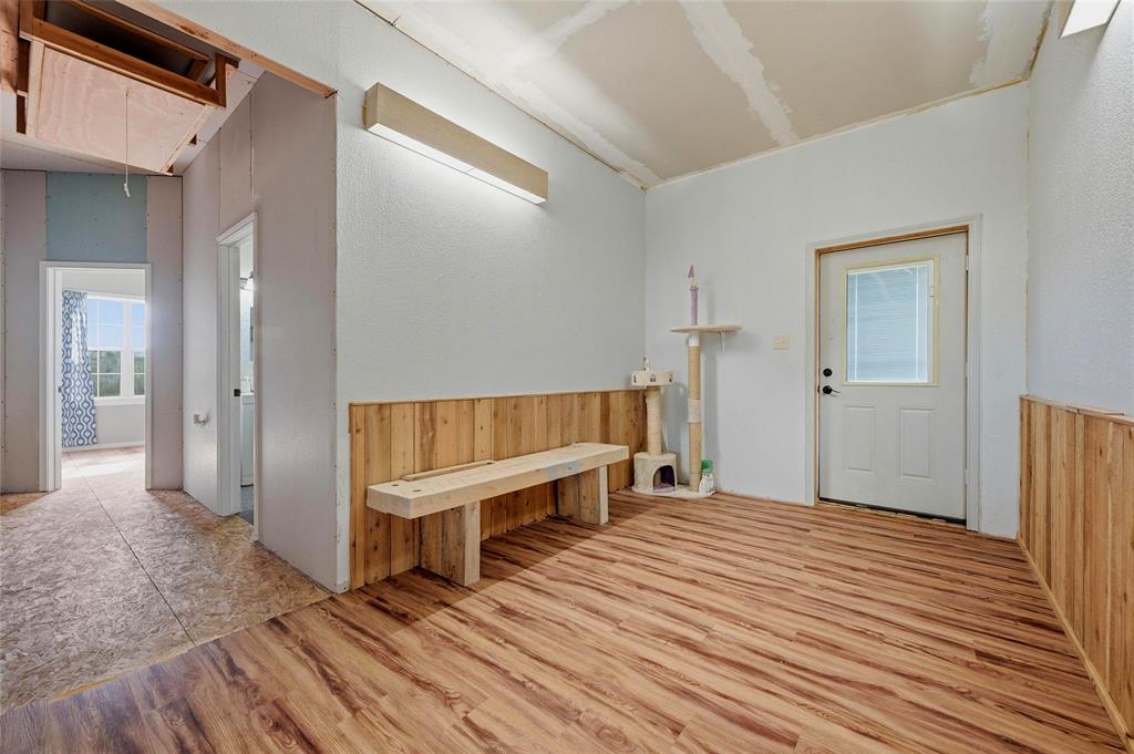 1464 Keyes Road Sherman, TX 75092 - Photo 16 of 29 a view of a hallway with wooden floor and staircase